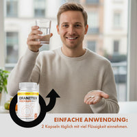 Thumbnail for Lächelnder Mann zeigt Kapseln und Glas Wasser, Produktabbildung Granitex Premium mit Dosierangabe