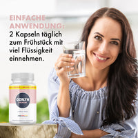 Thumbnail for Frau hält ein Glas Wasser neben Ozalyn Premium mit Einnahmehinweis zu 2 Kapseln täglich morgens
